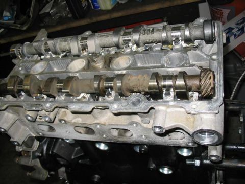 1993 Ford Probe - Close-up of an engine's cylinder head, revealing the camshafts and associated components.