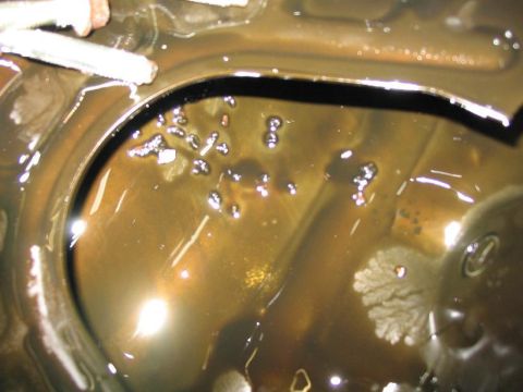 1993 Ford Probe - This image shows engine oil with visible contaminants, suggesting potential mechanical issues.