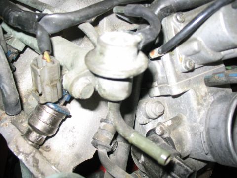 1993 Ford Probe - Engine components, including fuel injectors and associated wiring, are shown in this close-up view.