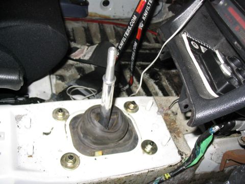 1993 Ford Probe - Close-up view of a car's manual gear shifter and the surrounding interior, showing some wiring and K&N Filters branding.
