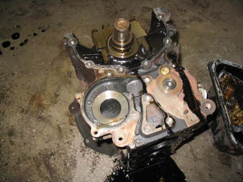1993 Ford Probe - Close-up view of a disassembled engine block, showing internal parts and oil staining.