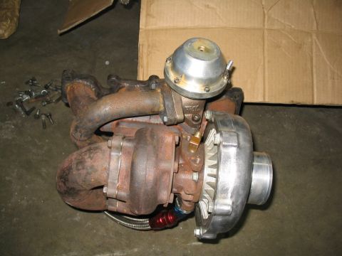 1993 Ford Probe - A turbocharger assembly, including the turbine housing, compressor housing, and wastegate actuator, is shown with associated plumbing and f…