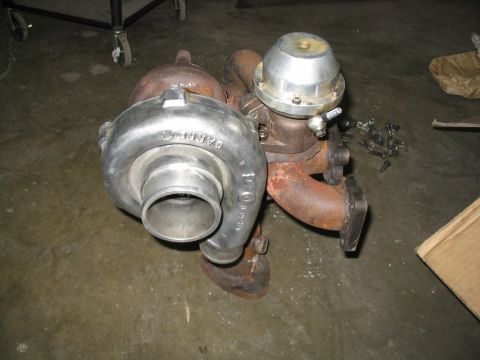 1993 Ford Probe - Turbocharger assembly with wastegate, likely for an older vehicle or performance application.