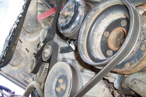 1994 Ford F-150 - Close-up view of the engine's serpentine belt and pulley system.