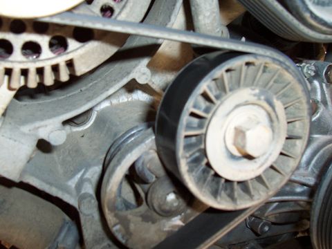 1994 Ford F-150 - Engine belt tensioner pulley system detail.