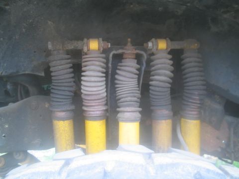 1983 Ford F-250 - Close-up of the rear suspension system, showing multiple shock absorbers.