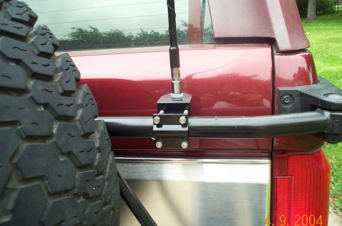 1996 Ford Bronco - Rear view of a 1996 Ford Bronco showing the spare tire and antenna mount.