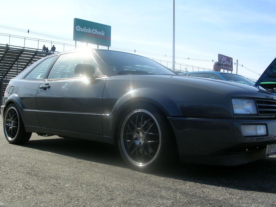 Dark gray Volkswagen Corrado parked outside with a QuickChek sign in the background