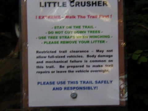 1978 Ford Bronco - This sign details trail rules and restrictions, including warnings about restricted clearance and potential vehicle damage.