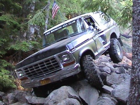 1978 Ford Bronco - This 1978 Ford Bronco is tackling a challenging off-road course on a rocky incline.