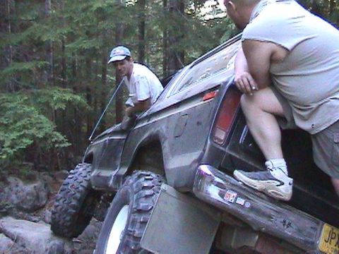 1978 Ford Bronco - A 1978 Ford Bronco navigates a rocky trail with two men inside.
