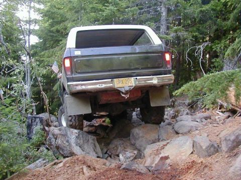 1978 Ford Bronco - This 1978 Ford Bronco is shown tackling a challenging rocky terrain, demonstrating its off-road capabilities.