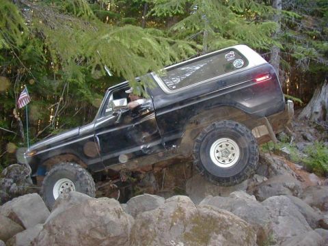 1978 Ford Bronco - This 1978 Ford Bronco navigates a challenging rocky terrain on a wooded trail.