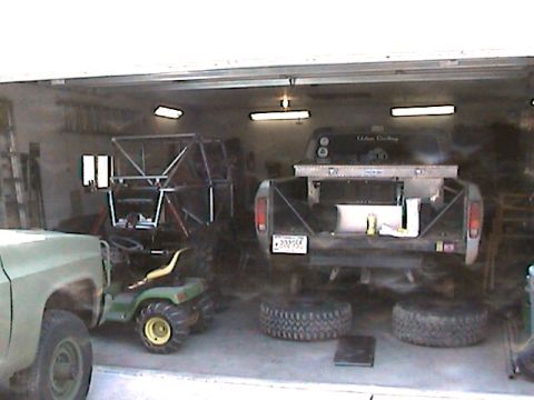 1977 Ford F-150 - This 1977 Ford F-150 shows its custom bed rack and toolbox, with spare tires nearby.