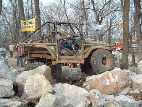 1992 Ford Bronco - A heavily modified off-road vehicle tackles a rocky obstacle course.