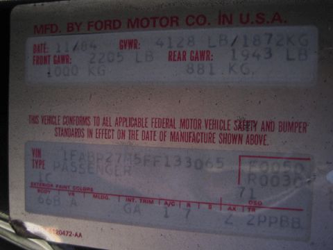 1985 Ford Mustang - Vehicle identification plate shows manufacture date of November 1984.