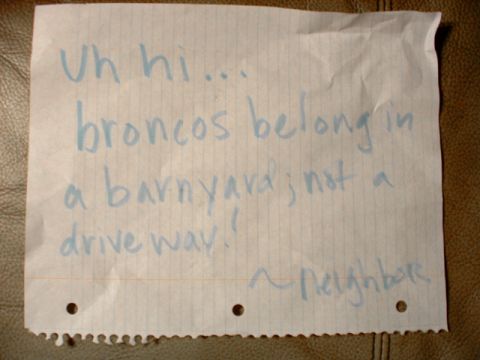 1993 Ford Bronco - A handwritten note expresses a neighbor's opinion about Broncos, suggesting they are better suited for a barnyard than a driveway.