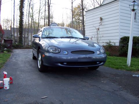 1999 Ford Taurus - Front view of a 1999 Ford Taurus parked on a driveway.