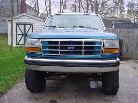 1993 Ford F-150 - Front view of a teal Ford F-150 pickup truck with a chrome bumper and grille.