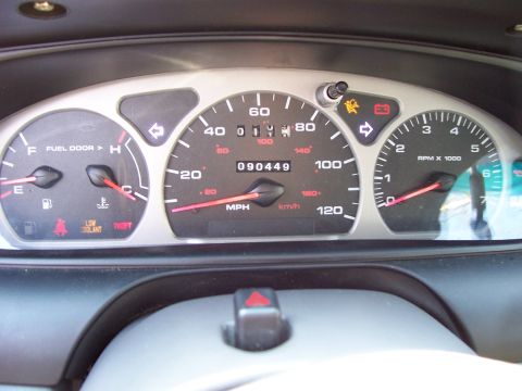 1999 Ford Taurus - The instrument cluster displays the odometer reading of 090449 and various indicator lights.