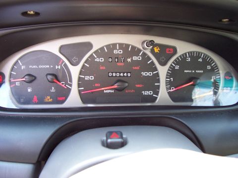 1999 Ford Taurus - The instrument cluster displays the speedometer, tachometer, fuel level, and various warning indicators.