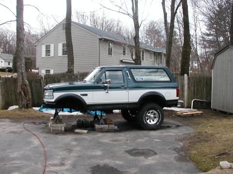 1994 Ford Bronco - This 1994 Ford Bronco is parked on jack stands in a residential driveway.