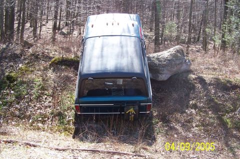 1979 Ford Bronco - This 1979 Ford Bronco appears to be stuck on a large rock while navigating an off-road trail.