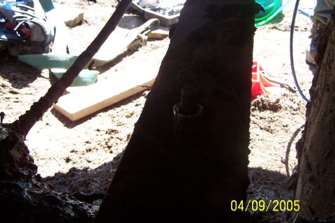1979 Ford Bronco - A close-up view of a vehicle's undercarriage and surrounding dirt, with a date stamp of 04/09/2005.
