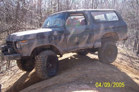 1979 Ford Bronco - This classic Ford Bronco is shown navigating a challenging off-road trail.