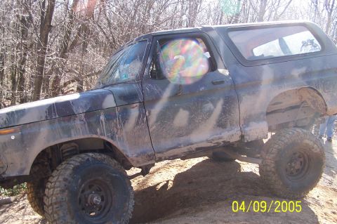 1979 Ford Bronco - This heavily muddied 1978 Ford Bronco is captured mid-off-road adventure.