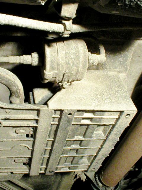 2003 Ford Escape - 3) Locate the fuel filter underneath the vehicle. It will be on the driver’s side, inboard from the rear passenger door, and fitted up agai…