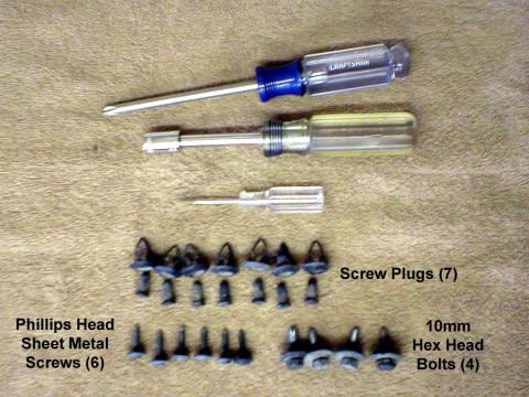 2003 Ford Escape - Here’s all the hardware, and tools used. The small screwdriver was used to pop out the plastic screw-plugs. The nut driver is a 10mm hex.