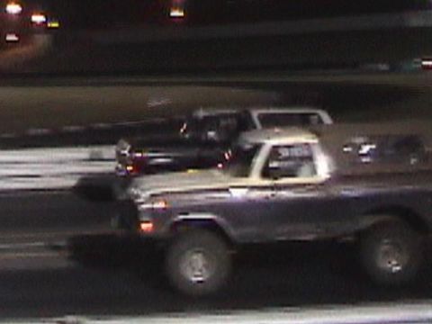 1978 Ford Bronco - Two vehicles on a track at night, the foreground vehicle is a 1978 Ford Bronco.