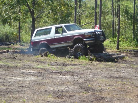 1993 Ford Bronco - This 1993 Ford Bronco navigates a challenging off-road course with large tires and a lifted suspension.