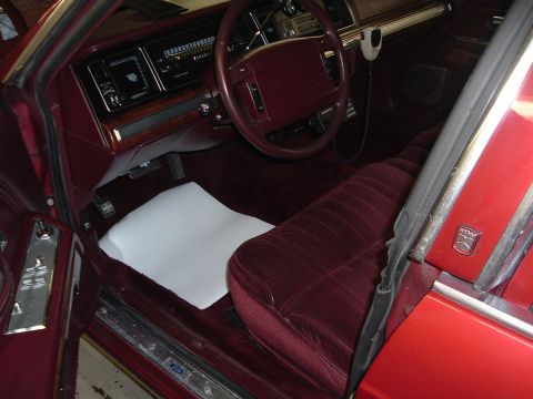 2001 Ford Crown Victoria - Interior view of a car, showing the seats, dashboard, and steering wheel.