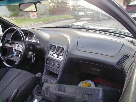 1993 Ford Probe - Interior view of a 1993 Ford Probe, showing the dashboard, steering wheel, and center console.