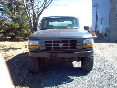 1993 Ford Bronco - Front view of a 1993 Ford Bronco parked outdoors.