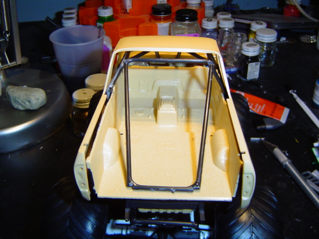 Model truck bed with roll cage, unpainted, viewed from rear