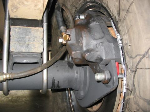 1995 Ford Bronco - close up of caliper. no more than 1/8" clearance to rim.