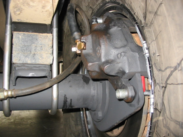 close up of caliper.  no more than 1/8" clearance to rim.