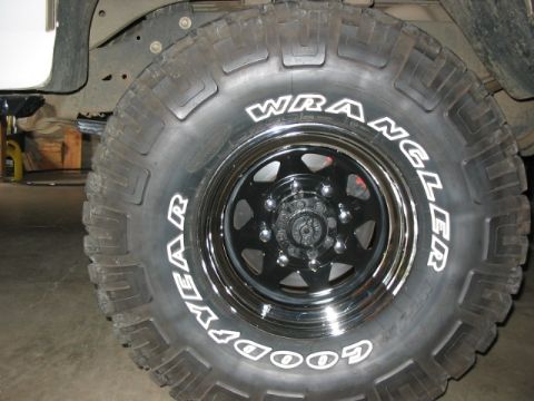 1995 Ford Bronco - Close-up of a Goodyear Wrangler off-road tire and black wheel.