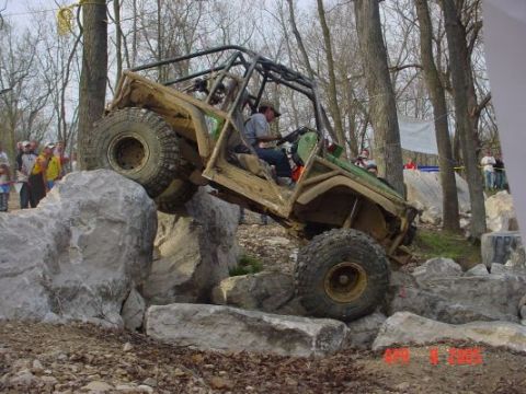 1992 Ford Bronco - A heavily modified off-road vehicle navigates a challenging rock crawling course.