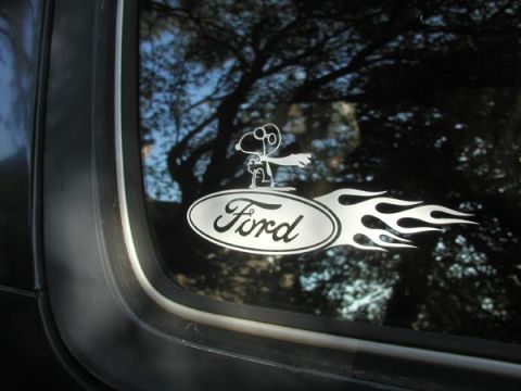 1988 Ford Bronco - A Ford logo sticker with Snoopy and flames is visible on the window of a vehicle.