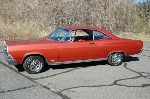 1966 Ford Fairlane - This 1966 Ford Fairlane coupe displays its distinctive body style and chrome accents from a three-quarter front perspective.