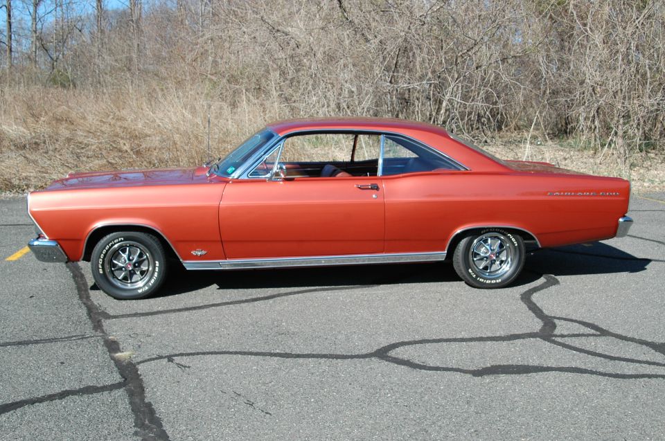 Copper-orange Ford Fairlane 500 hardtop, driver-side profile with white-letter BFGoodrich tires