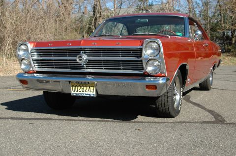 1966 Ford Fairlane - Front view of an orange 1966 Ford Fairlane parked on asphalt.