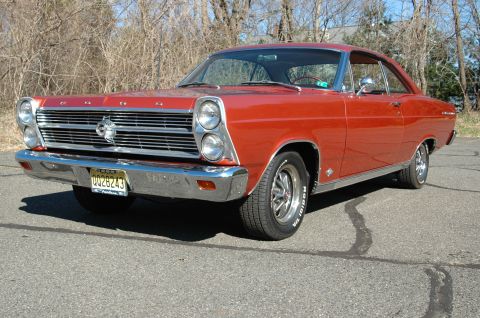 1966 Ford Fairlane - This 1966 Ford Fairlane coupe features a distinctive chrome grille and front bumper, seen from a 3/4 front angle.