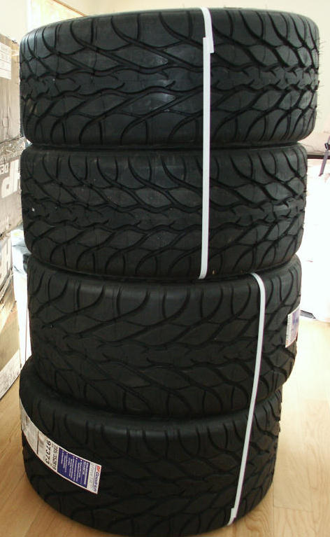 2001 Mercury Grand Marquis - A stack of four BF Goodrich KDW-2 tires, each secured with white strapping, are presented for sale.