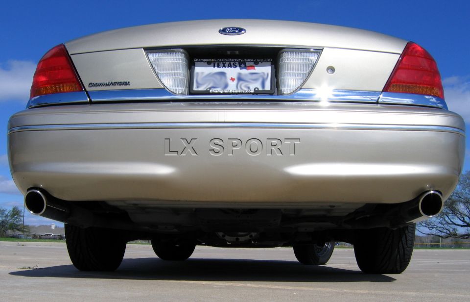 Rear view of a 2000 Ford Crown Victoria LX Sport with dual exhaust pipes