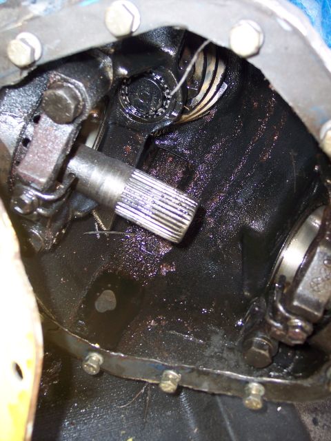 1988 Ford Bronco - Internal view of a vehicle's differential housing, showing gears and an axle shaft.